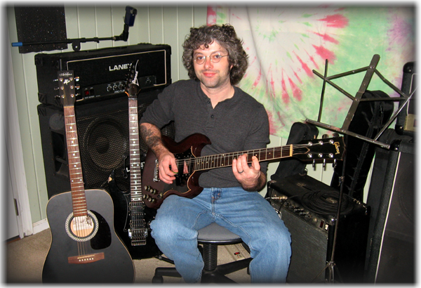 Stephen in the lessons studio, with an SG