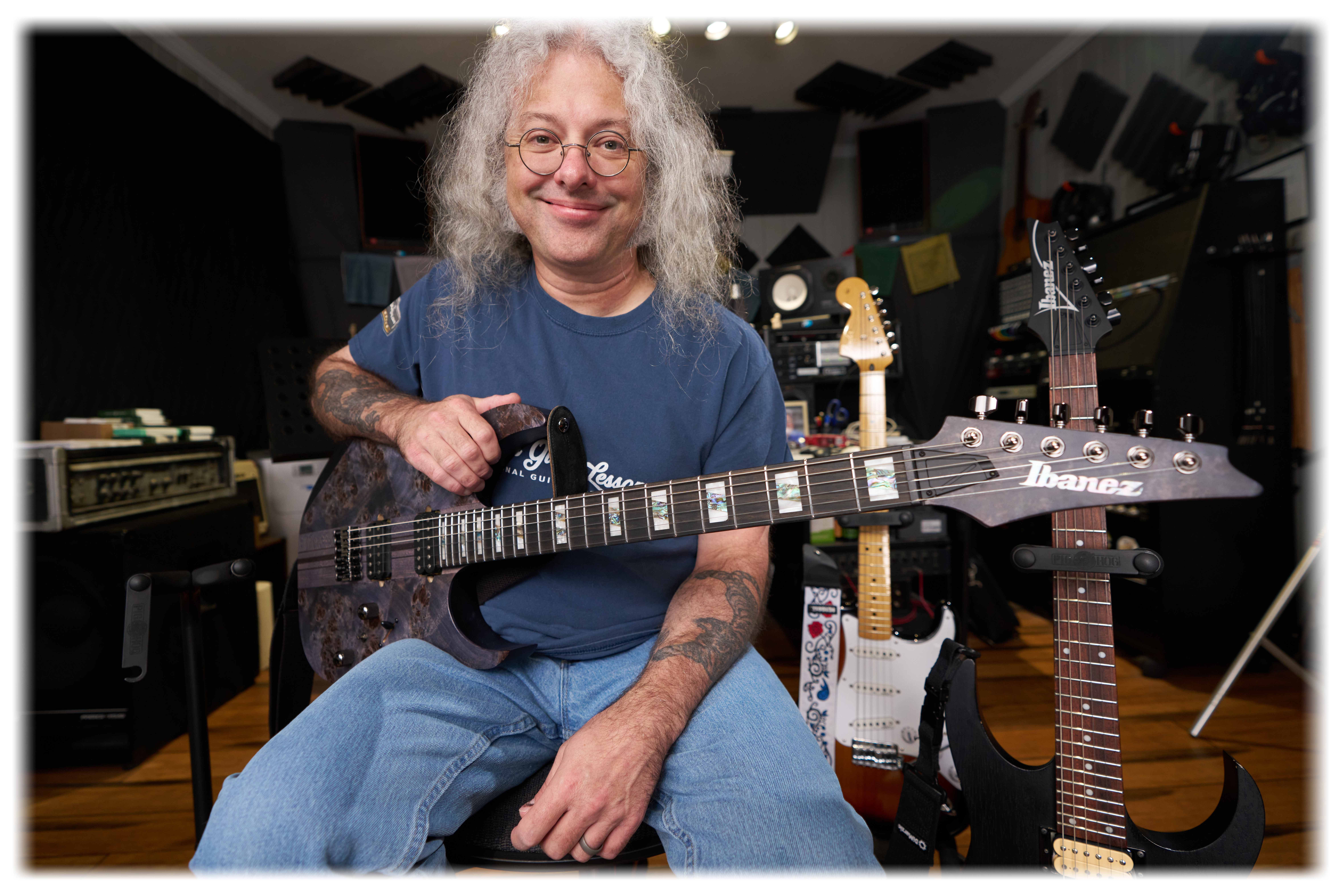 Stephen in his lessons studio playing his Ibanez RGT1221